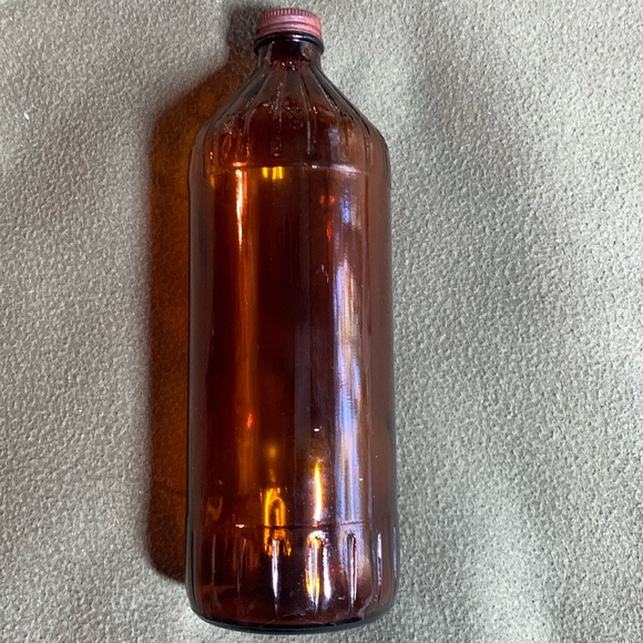 Other - Vintage brown glass bottle with lid.  Ridge details.  Approximately 3” x 10”